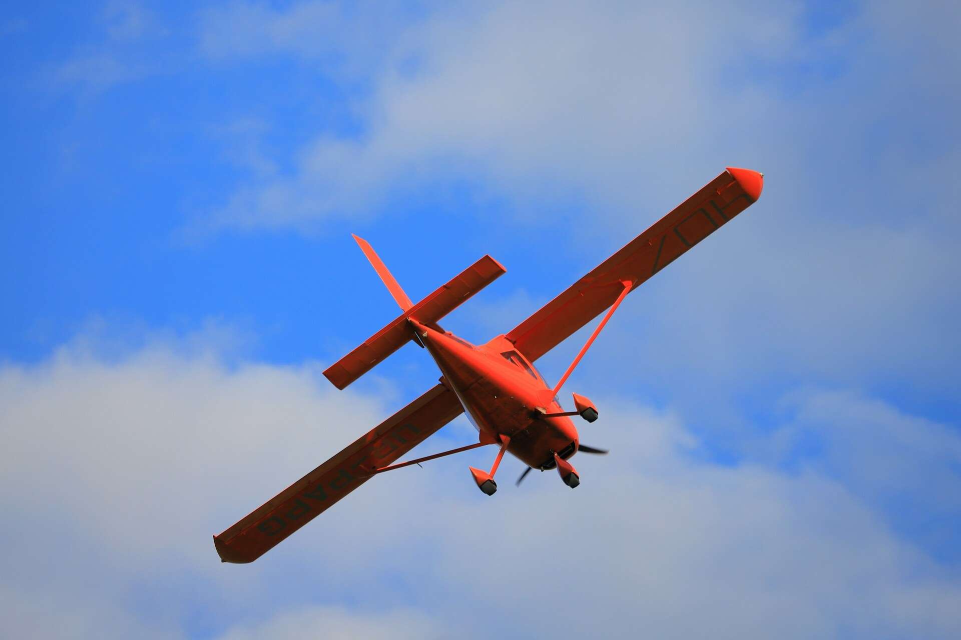 Red biplane aerial
